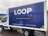 Loop Recycling van parked, displaying company branding and logo.